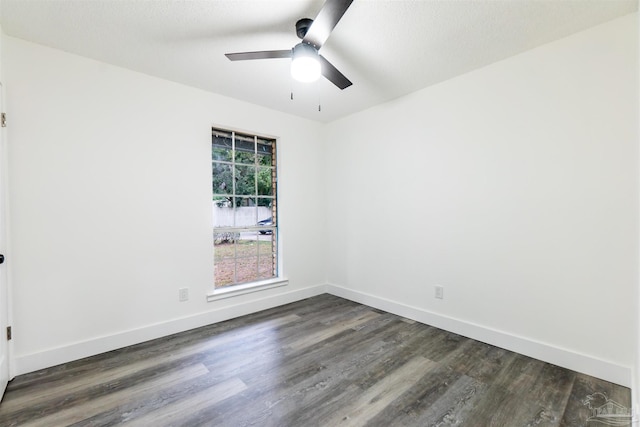 spare room with ceiling fan, dark hardwood / wood-style flooring, and a textured ceiling