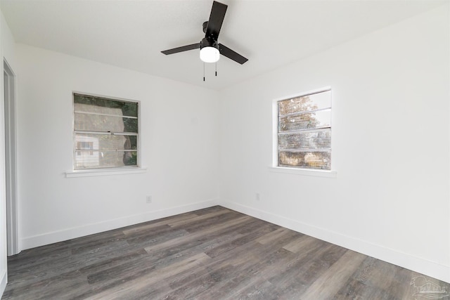 empty room featuring ceiling fan and dark wood-type flooring