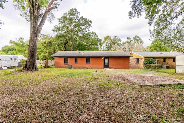 back of house featuring central AC unit