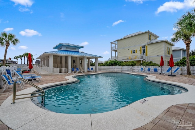 view of swimming pool with a patio