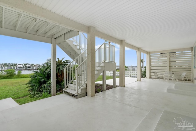 view of patio featuring a water view