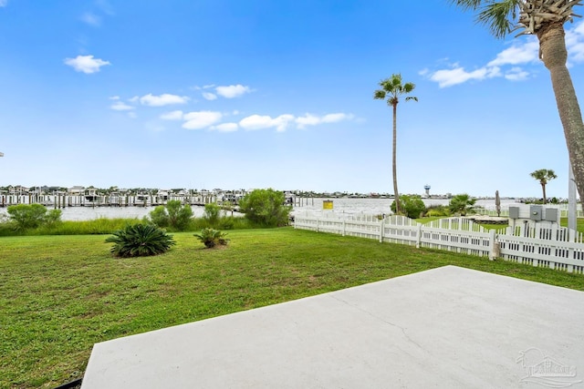 view of yard with a patio and a water view