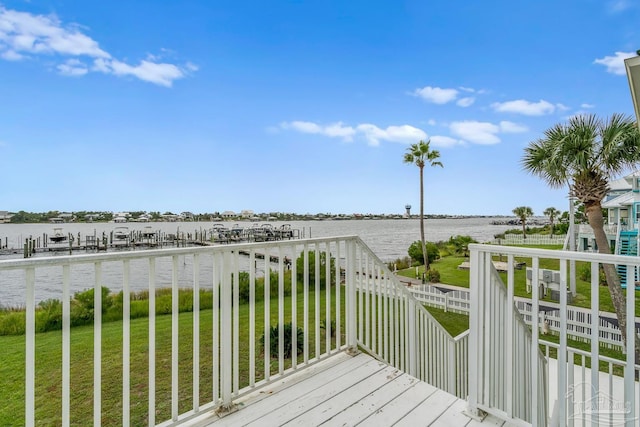 deck featuring a yard and a water view