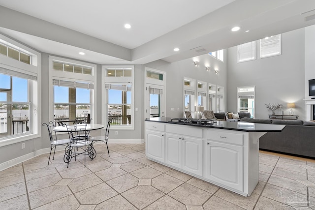 kitchen featuring white cabinets and black gas stovetop