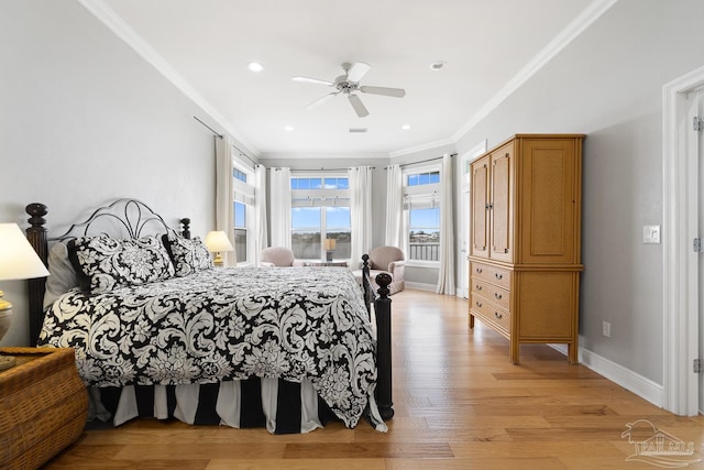 bedroom with light hardwood / wood-style flooring, ceiling fan, and ornamental molding