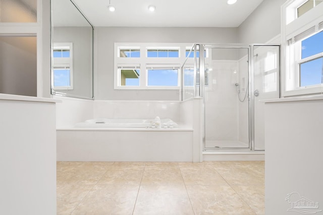 bathroom featuring separate shower and tub and tile patterned floors