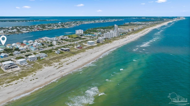 drone / aerial view featuring a view of the beach and a water view