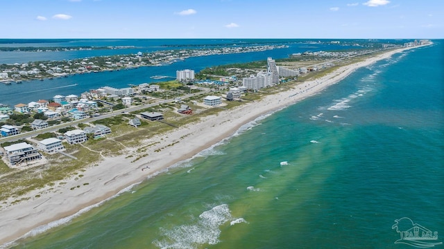 bird's eye view featuring a water view and a beach view