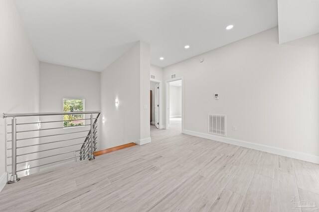 empty room with light wood-type flooring