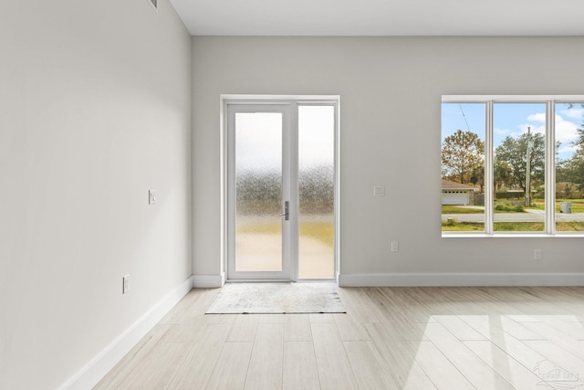 spare room featuring light hardwood / wood-style floors