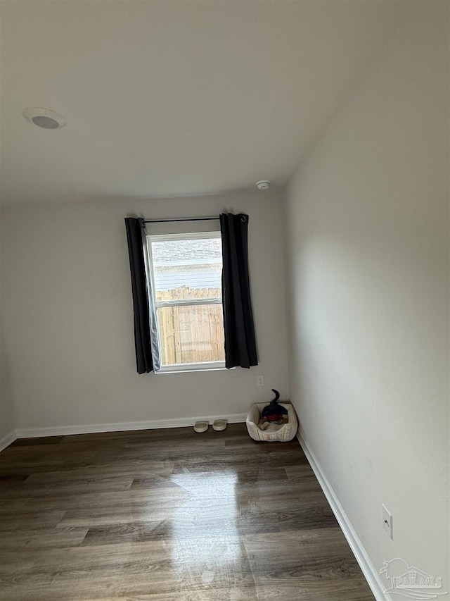 6312 June Bug Dr, Milton, FL 32583 - spare room with baseboards and wood finished floors