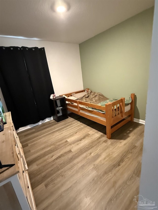 6312 June Bug Dr, Milton, FL 32583 - bedroom with wood finished floors and baseboards
