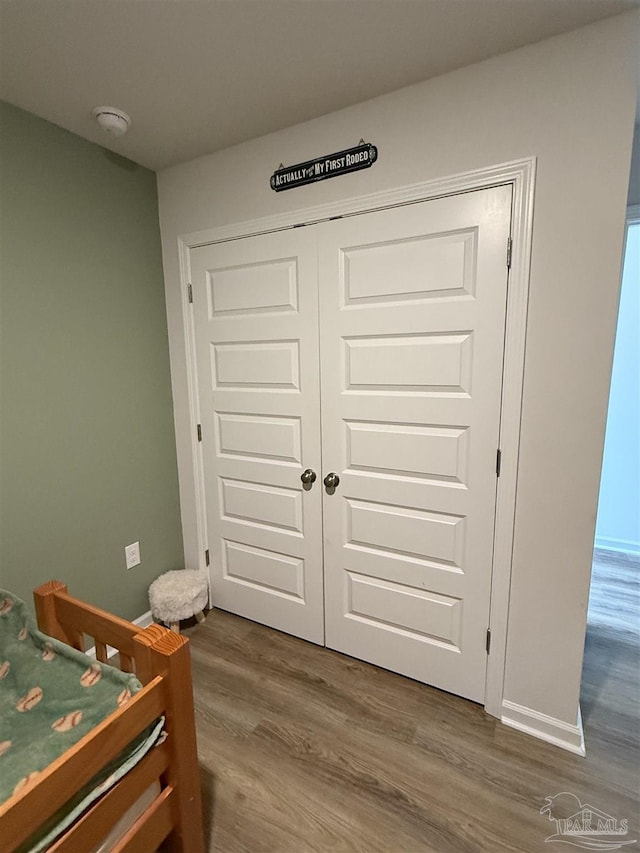 6312 June Bug Dr, Milton, FL 32583 - bedroom featuring wood finished floors and a closet