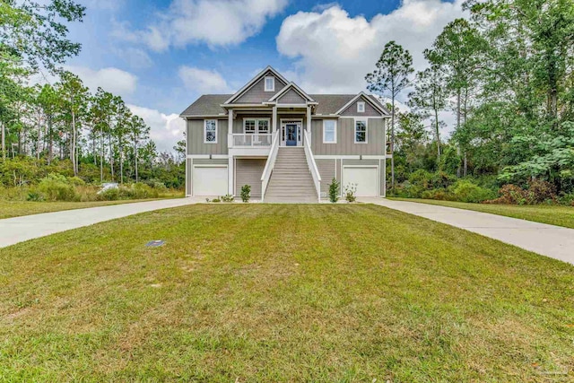 view of front of property featuring a garage and a front lawn