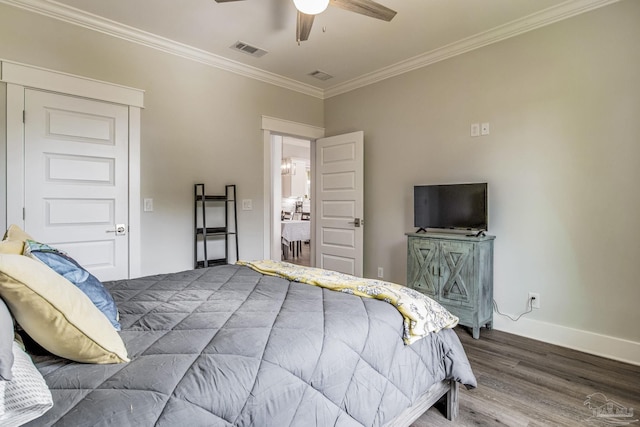 bedroom with ornamental molding, hardwood / wood-style floors, and ceiling fan