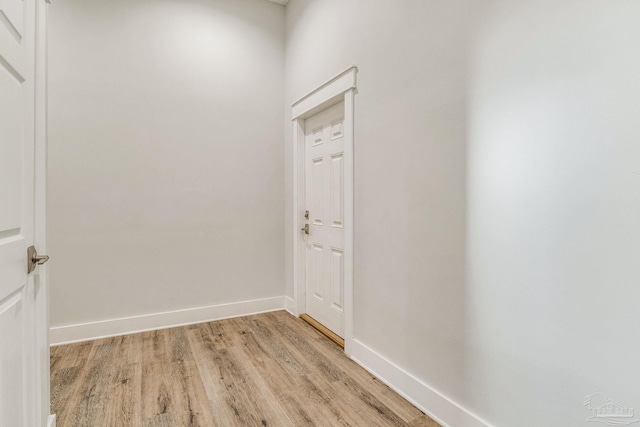 hall with light hardwood / wood-style floors