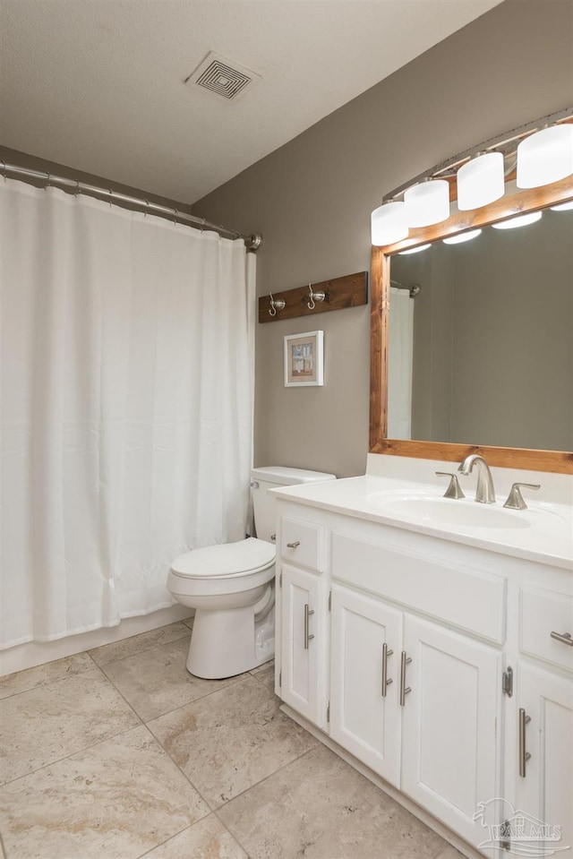 full bath with visible vents, toilet, curtained shower, and vanity