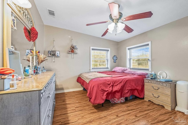 bedroom featuring wood-type flooring and ceiling fan