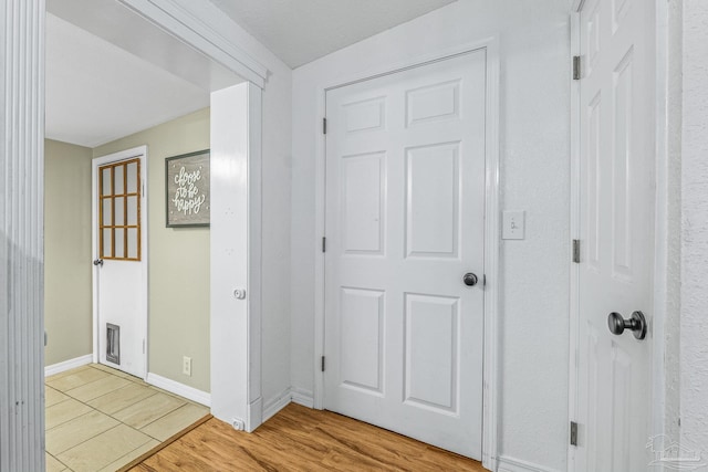 corridor featuring light hardwood / wood-style floors