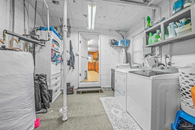 laundry room with washing machine and clothes dryer