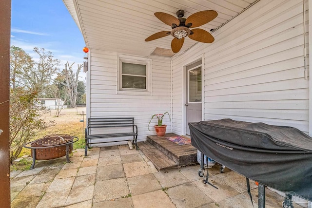 view of patio / terrace with grilling area and an outdoor fire pit