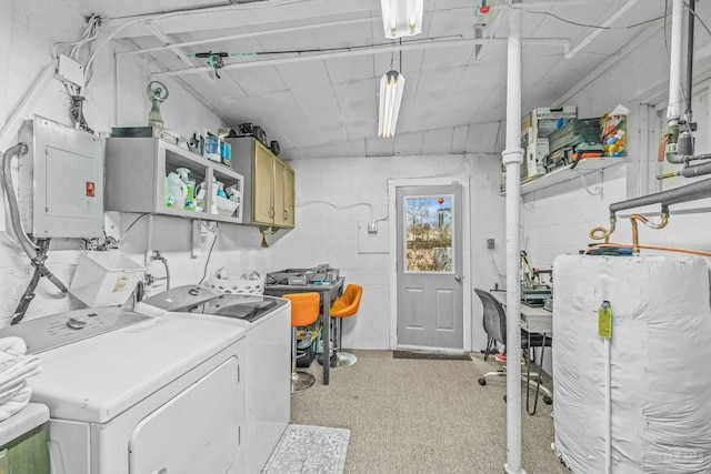 laundry room featuring cabinets, separate washer and dryer, and electric panel