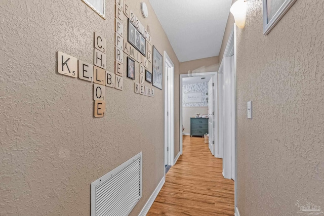 hallway featuring light wood-type flooring