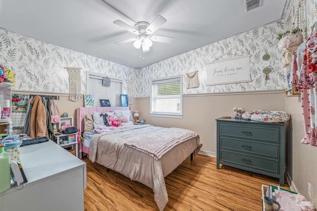 bedroom featuring ceiling fan and light hardwood / wood-style flooring