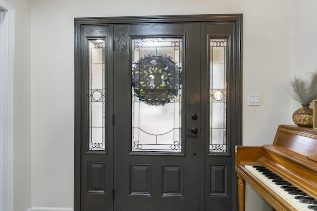 foyer featuring plenty of natural light