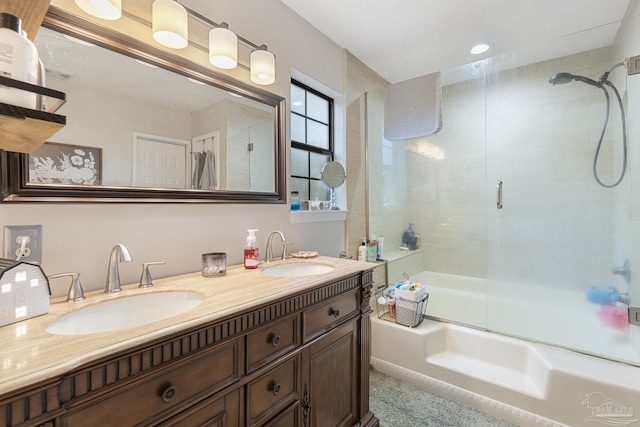 bathroom with enclosed tub / shower combo and vanity