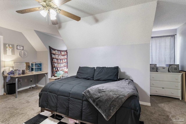 carpeted bedroom featuring lofted ceiling, ceiling fan, and a textured ceiling