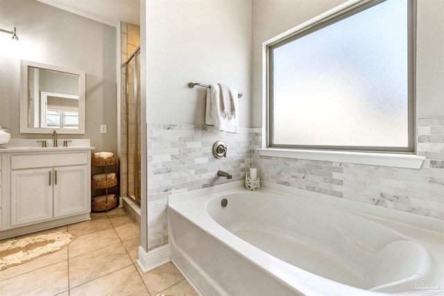 7956 Huntington Creek Ln, Pensacola, FL 32526 - full bath featuring a bath, vanity, tile patterned flooring, and a stall shower