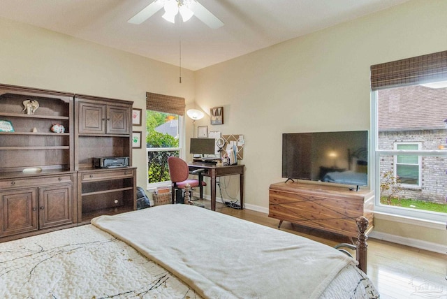 bedroom with ceiling fan and light hardwood / wood-style floors