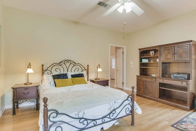 bedroom with ceiling fan and light hardwood / wood-style flooring