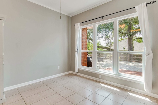 tiled empty room featuring crown molding