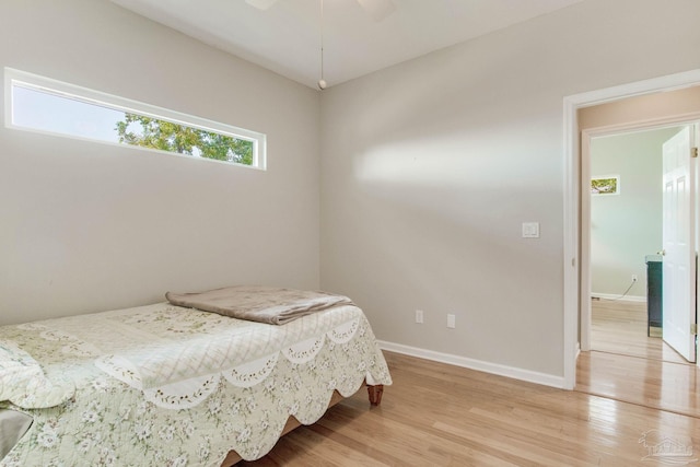 bedroom featuring ceiling fan and light wood-type flooring