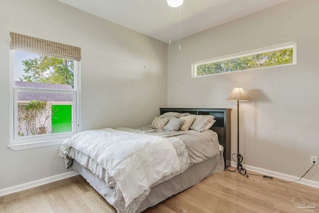 bedroom with hardwood / wood-style flooring