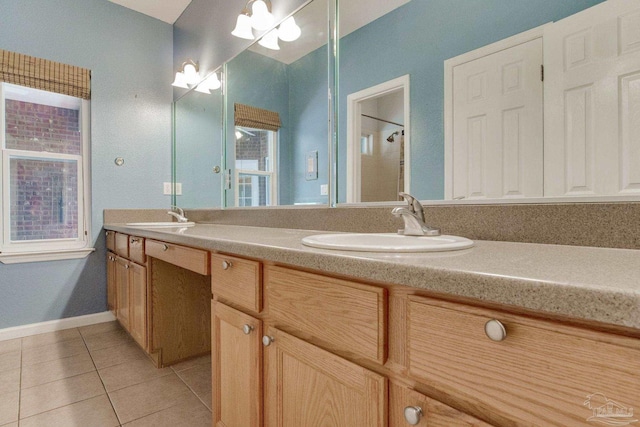 bathroom with tile patterned flooring, walk in shower, and vanity