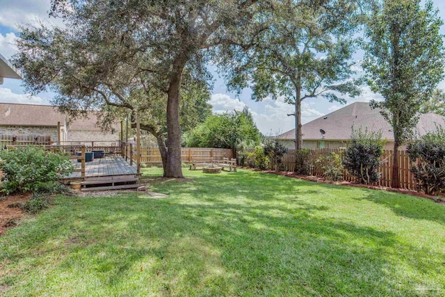 view of yard with a wooden deck