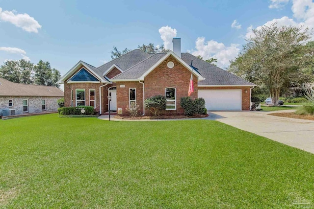 view of front of home with a garage, a front yard, and central AC unit