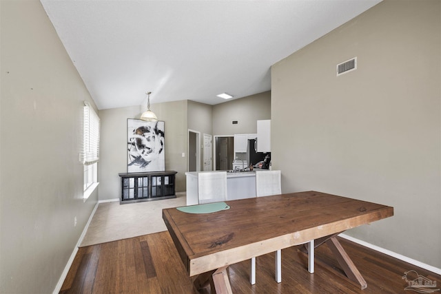 8187 Lode Star Ave, Pensacola, FL 32514 - dining space with baseboards, vaulted ceiling, and wood finished floors