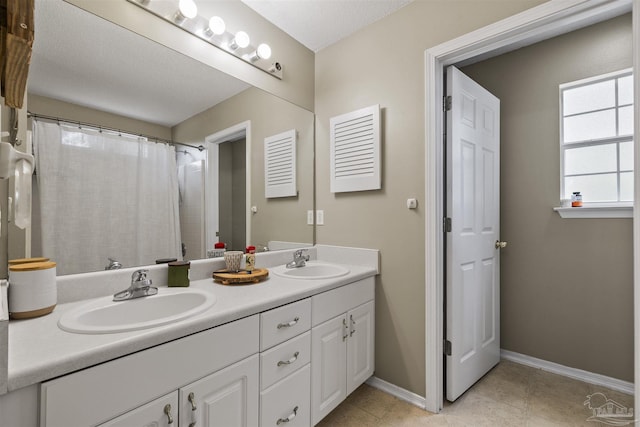 8187 Lode Star Ave, Pensacola, FL 32514 - bathroom with double vanity, baseboards, tile patterned floors, and curtained shower