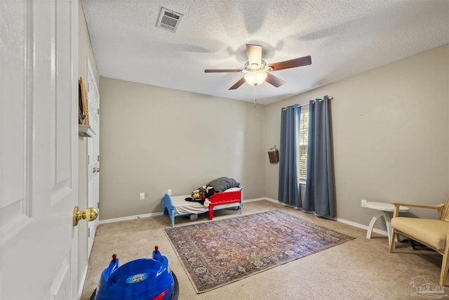 8187 Lode Star Ave, Pensacola, FL 32514 - sitting room with carpet, ceiling fan, a textured ceiling, and baseboards