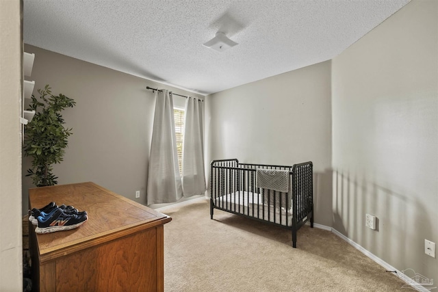 8187 Lode Star Ave, Pensacola, FL 32514 - bedroom featuring light carpet, a textured ceiling, and baseboards