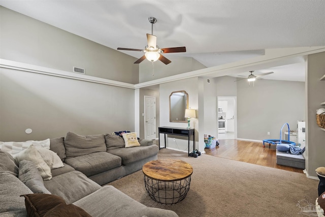 8187 Lode Star Ave, Pensacola, FL 32514 - living room with a ceiling fan, vaulted ceiling, baseboards, wood finished floors, and carpet flooring