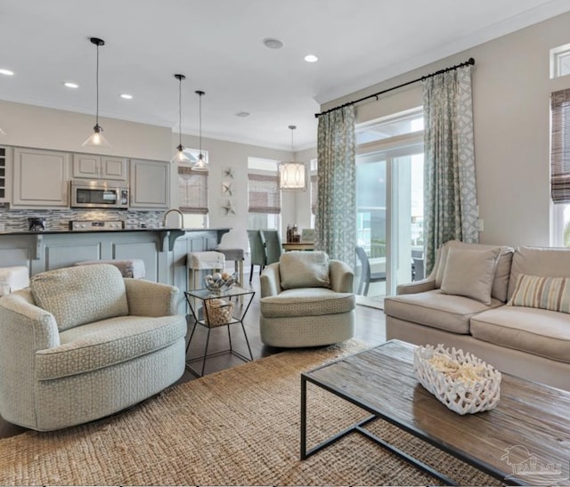 living room featuring crown molding