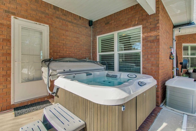 view of patio / terrace featuring a hot tub