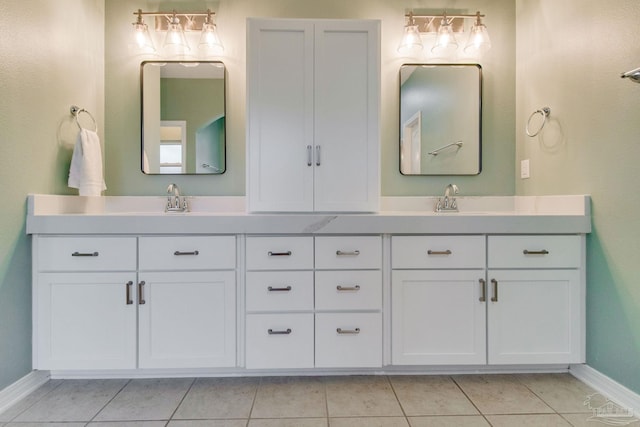 bathroom with tile patterned flooring and vanity