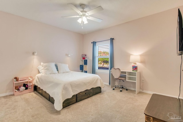 bedroom with ceiling fan and light carpet