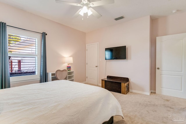 bedroom featuring light carpet and ceiling fan